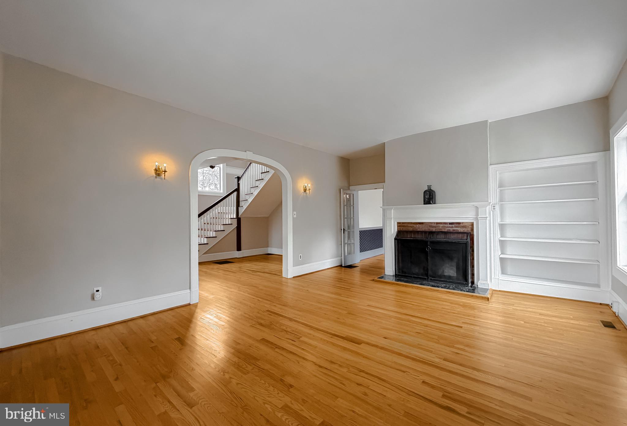 2790 Spout Lane Lusby, MD 20657 - Photo 28 of 95 a view of empty room with wooden floor and fireplace