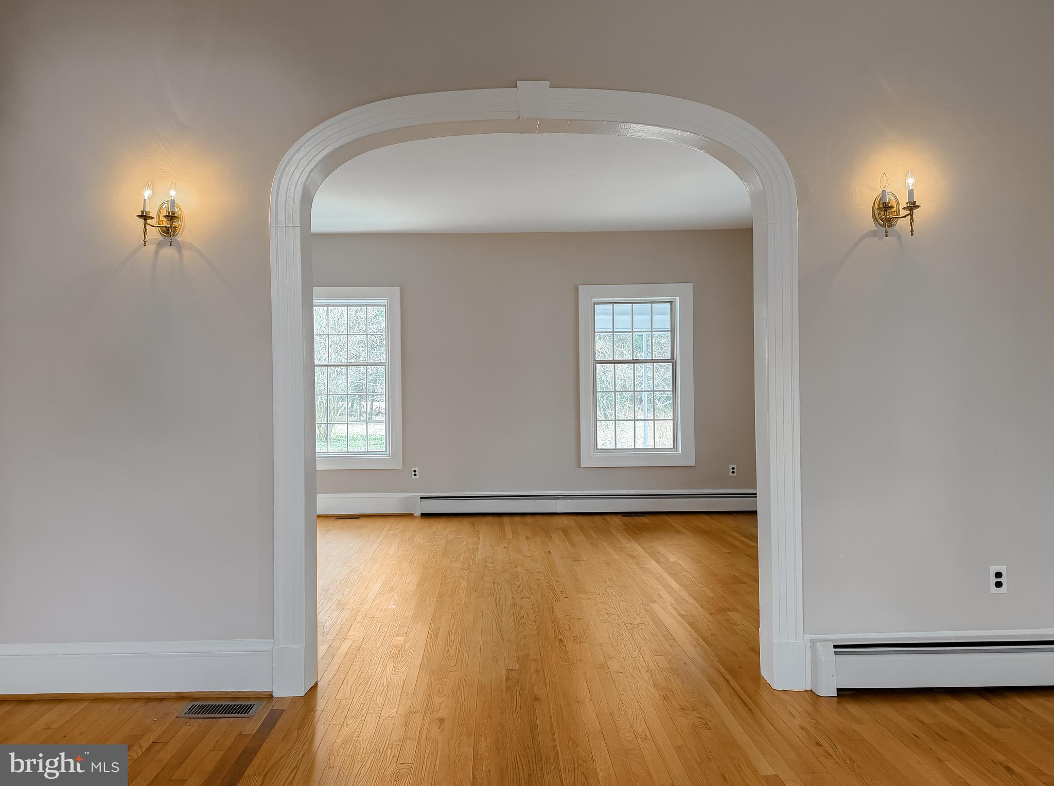 2790 Spout Lane Lusby, MD 20657 - Photo 34 of 95 an empty room with wooden floor and windows