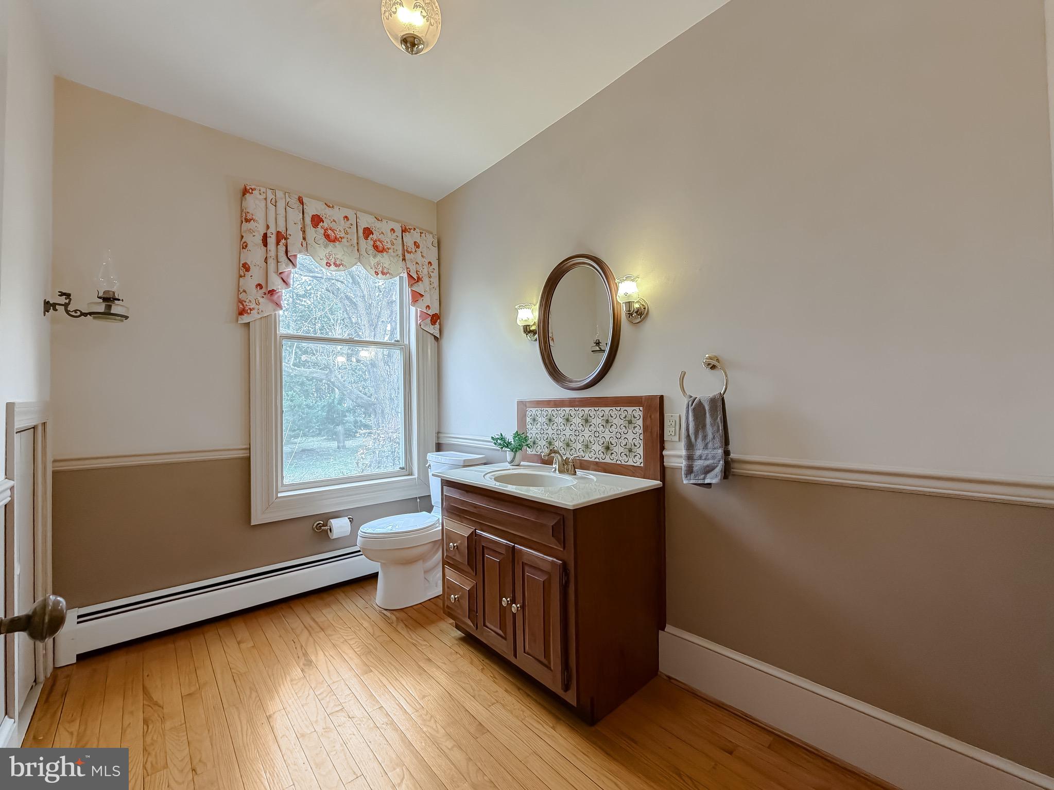 2790 Spout Lane Lusby, MD 20657 - Photo 37 of 95 a view of room with window and wooden floor