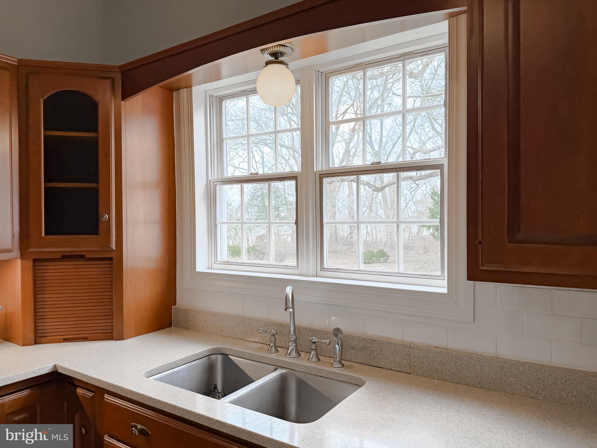 2790 Spout Lane Lusby, MD 20657 - Photo 40 of 95 a kitchen that has a sink and a window in it