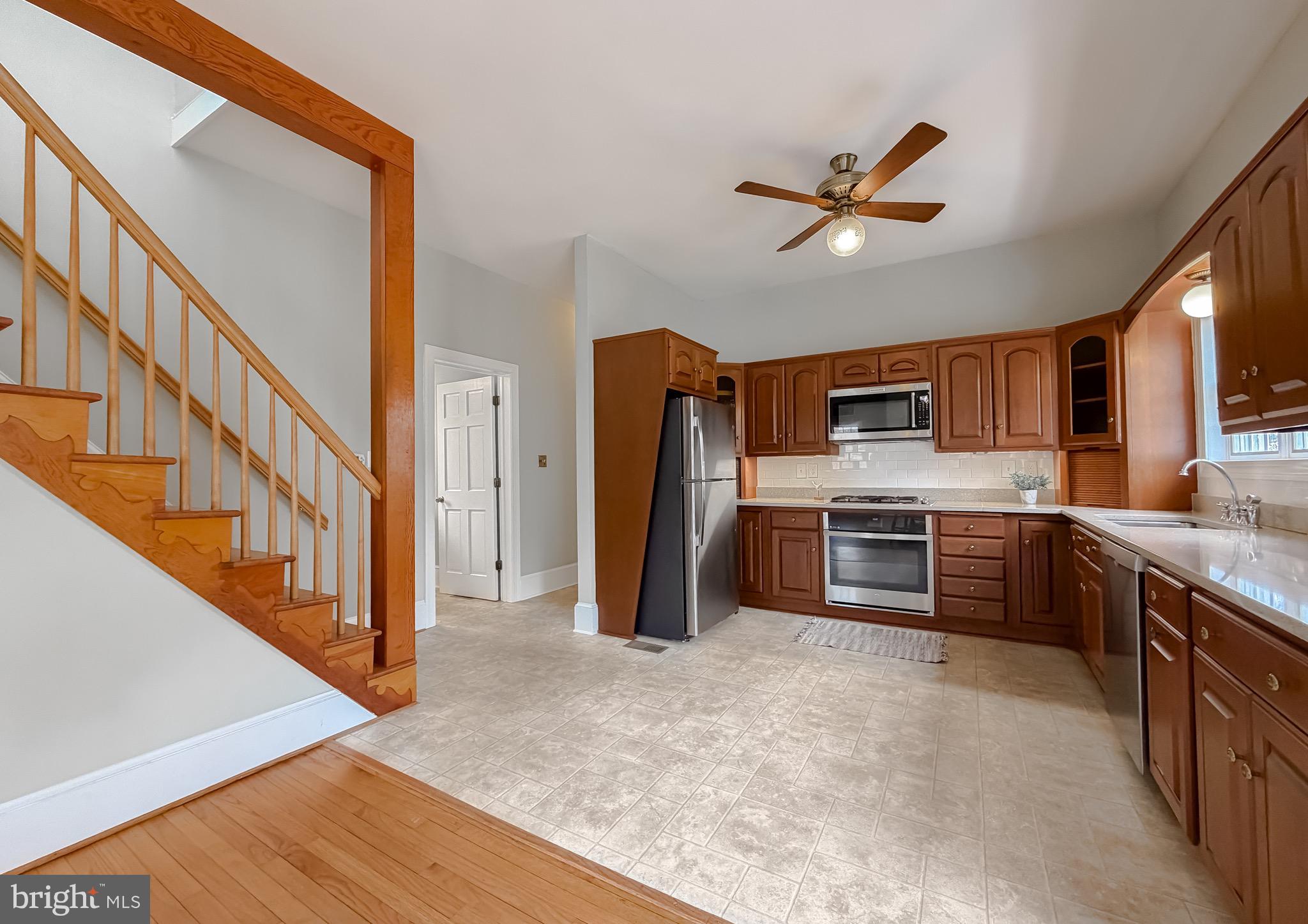 2790 Spout Lane Lusby, MD 20657 - Photo 41 of 95 a kitchen with stainless steel appliances granite countertop a refrigerator a stove top oven a sink and dishwasher