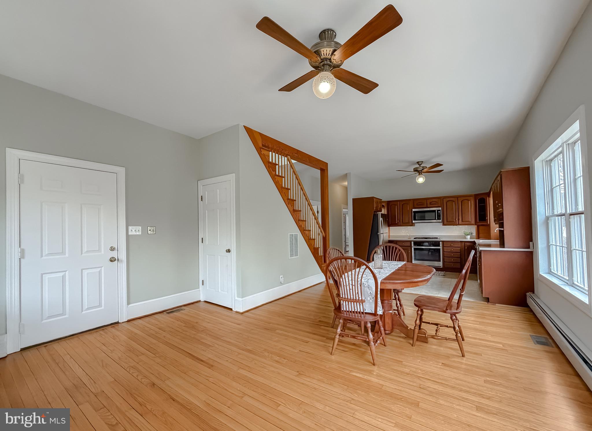 2790 Spout Lane Lusby, MD 20657 - Photo 45 of 95 a view of a livingroom with furniture a ceiling fan and wooden floor