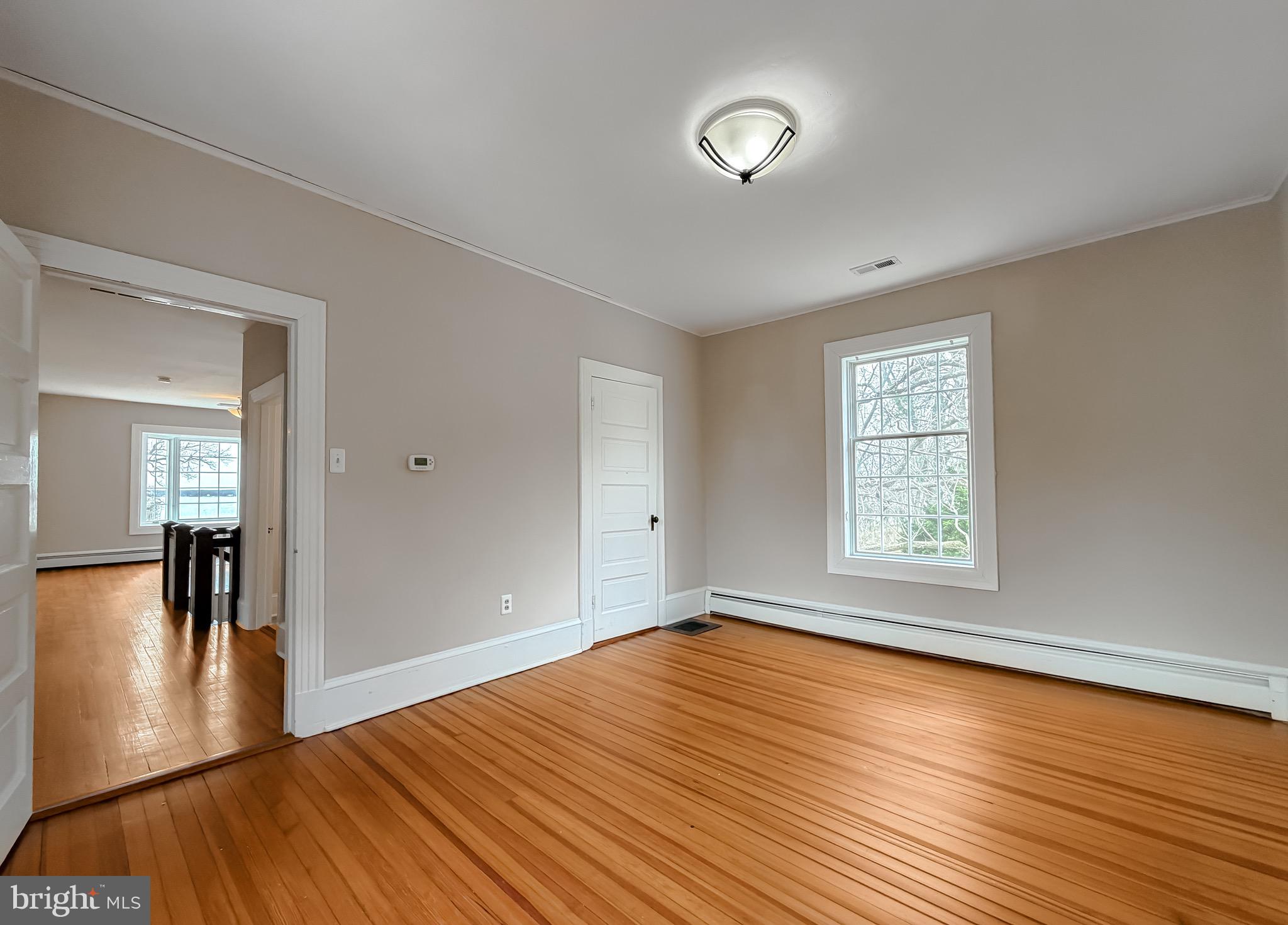 2790 Spout Lane Lusby, MD 20657 - Photo 60 of 95 wooden floor in an empty room with a window
