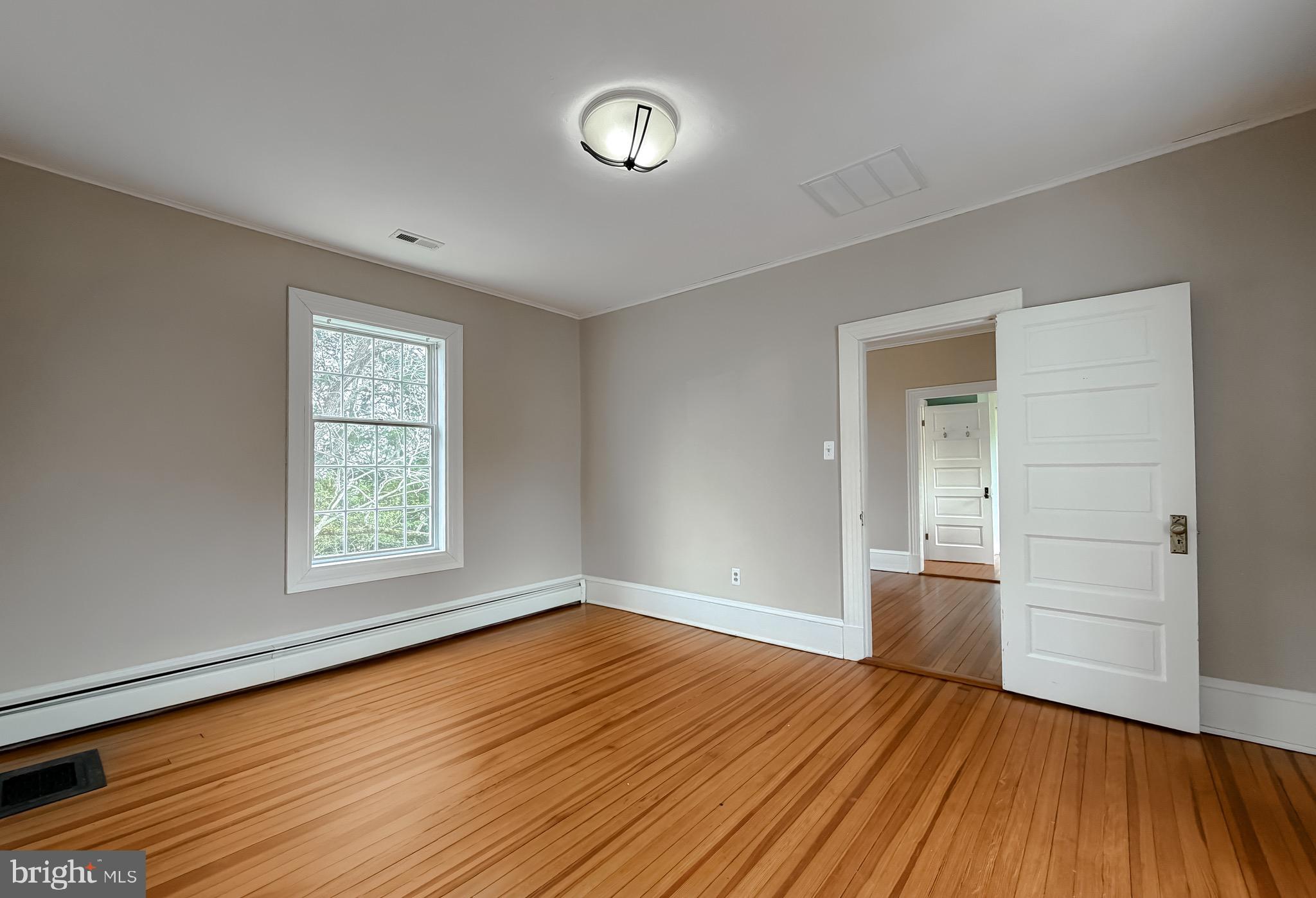 2790 Spout Lane Lusby, MD 20657 - Photo 66 of 95 wooden floor in an empty room with a window