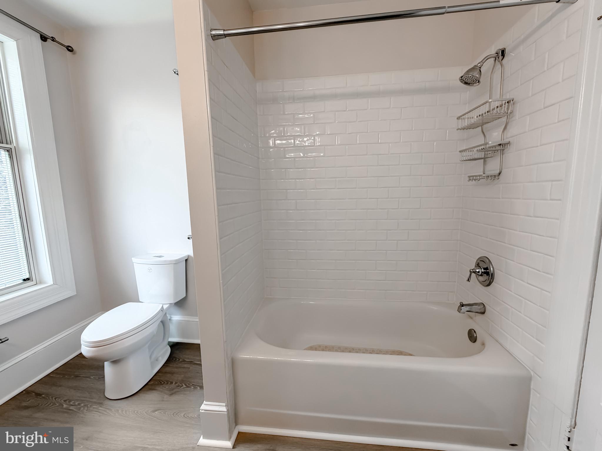 2790 Spout Lane Lusby, MD 20657 - Photo 67 of 95 a bathroom with a toilet and a bathtub