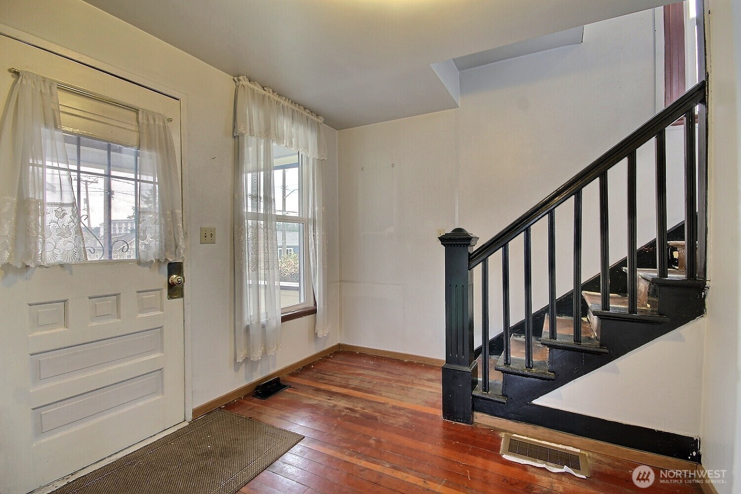 3902 South Angel Place Seattle, WA 98118 - Photo 13 of 39 a view of an entryway with wooden floor and door