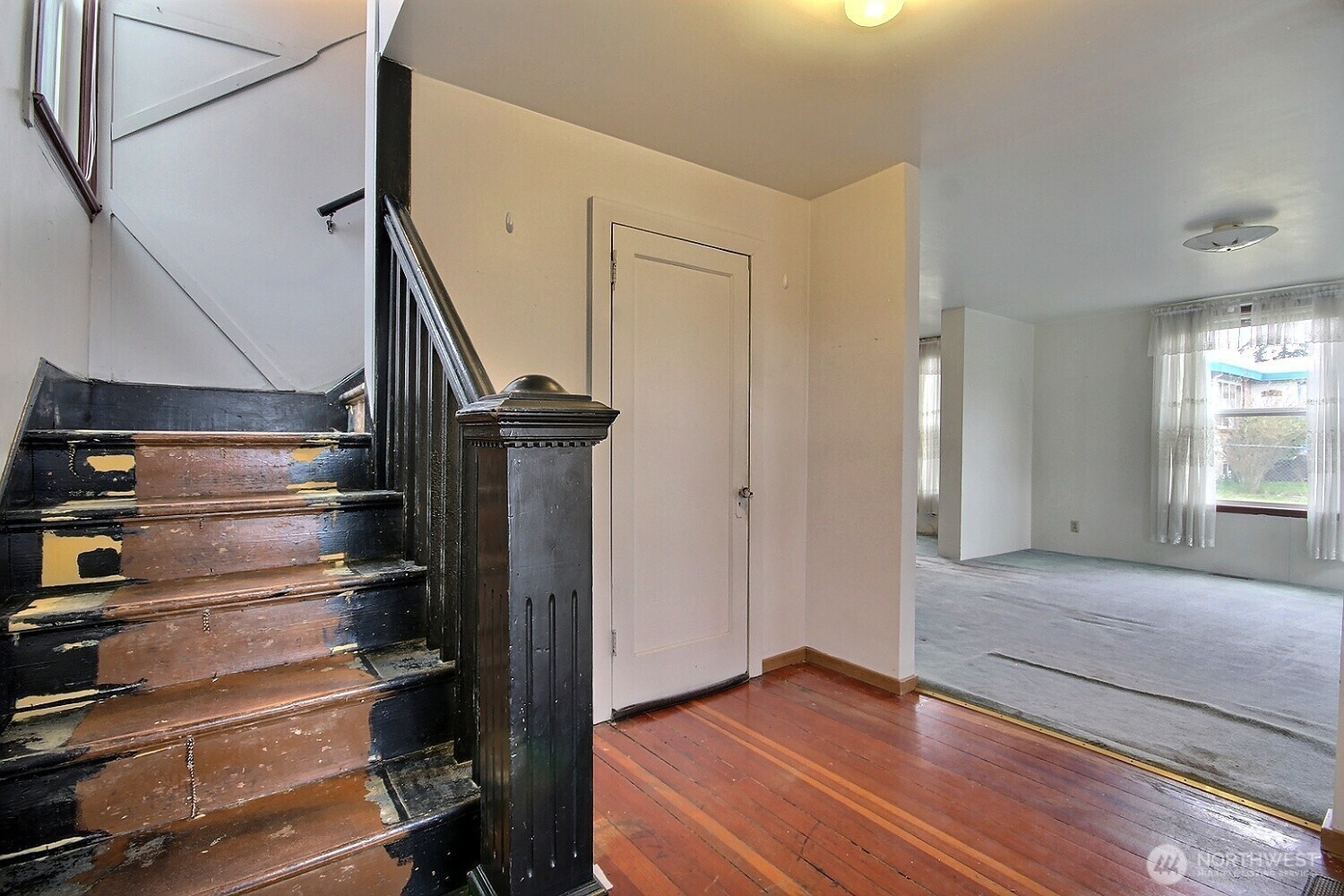3902 South Angel Place Seattle, WA 98118 - Photo 14 of 39 a view of empty room with wooden floor and fan