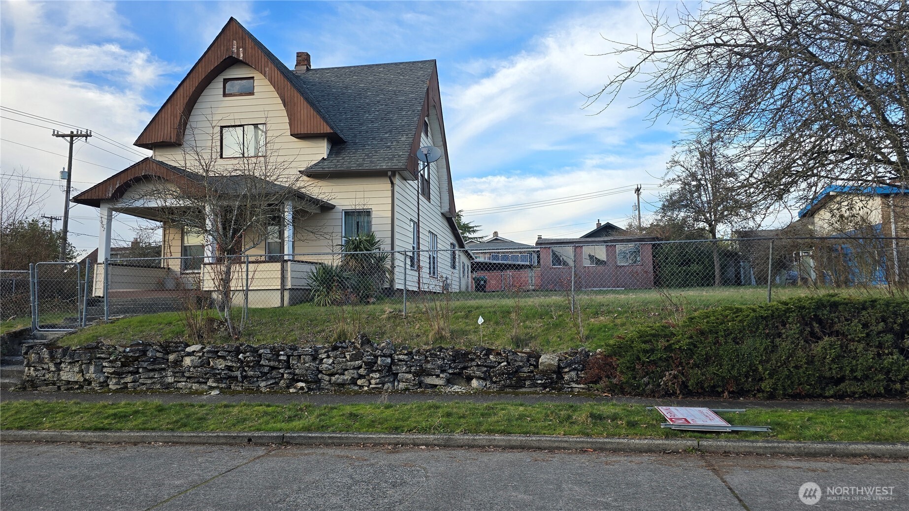 3902 South Angel Place Seattle, WA 98118 - Photo 2 of 39 a front view of a house with a garden