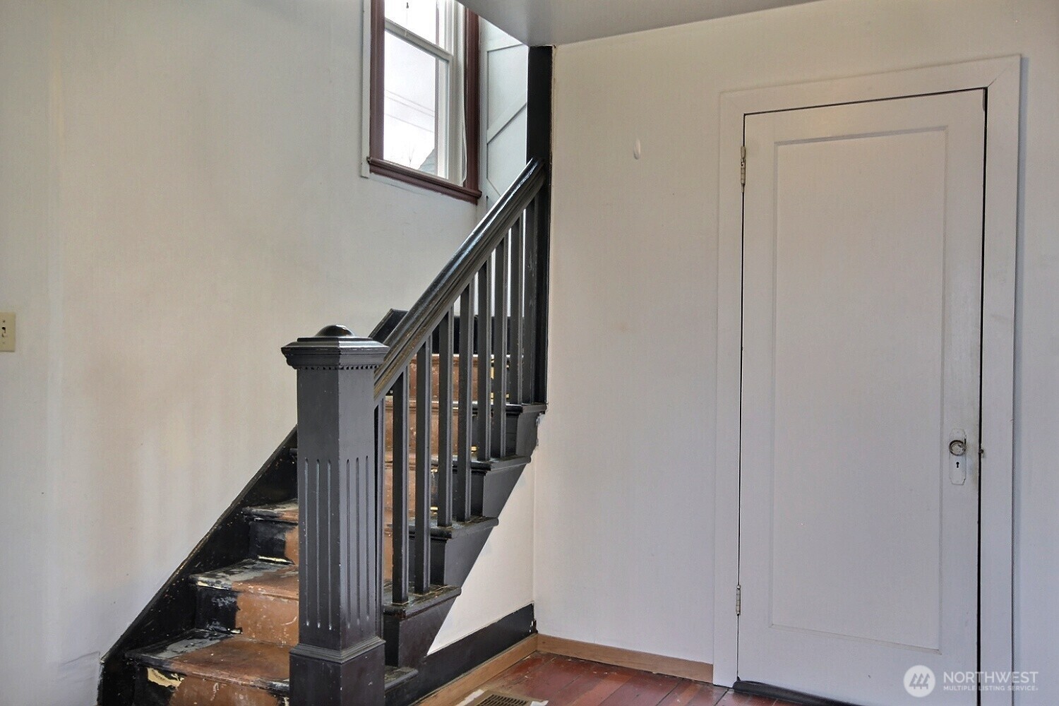 3902 South Angel Place Seattle, WA 98118 - Photo 26 of 39 a view of staircase with lots of frames on wall and a window