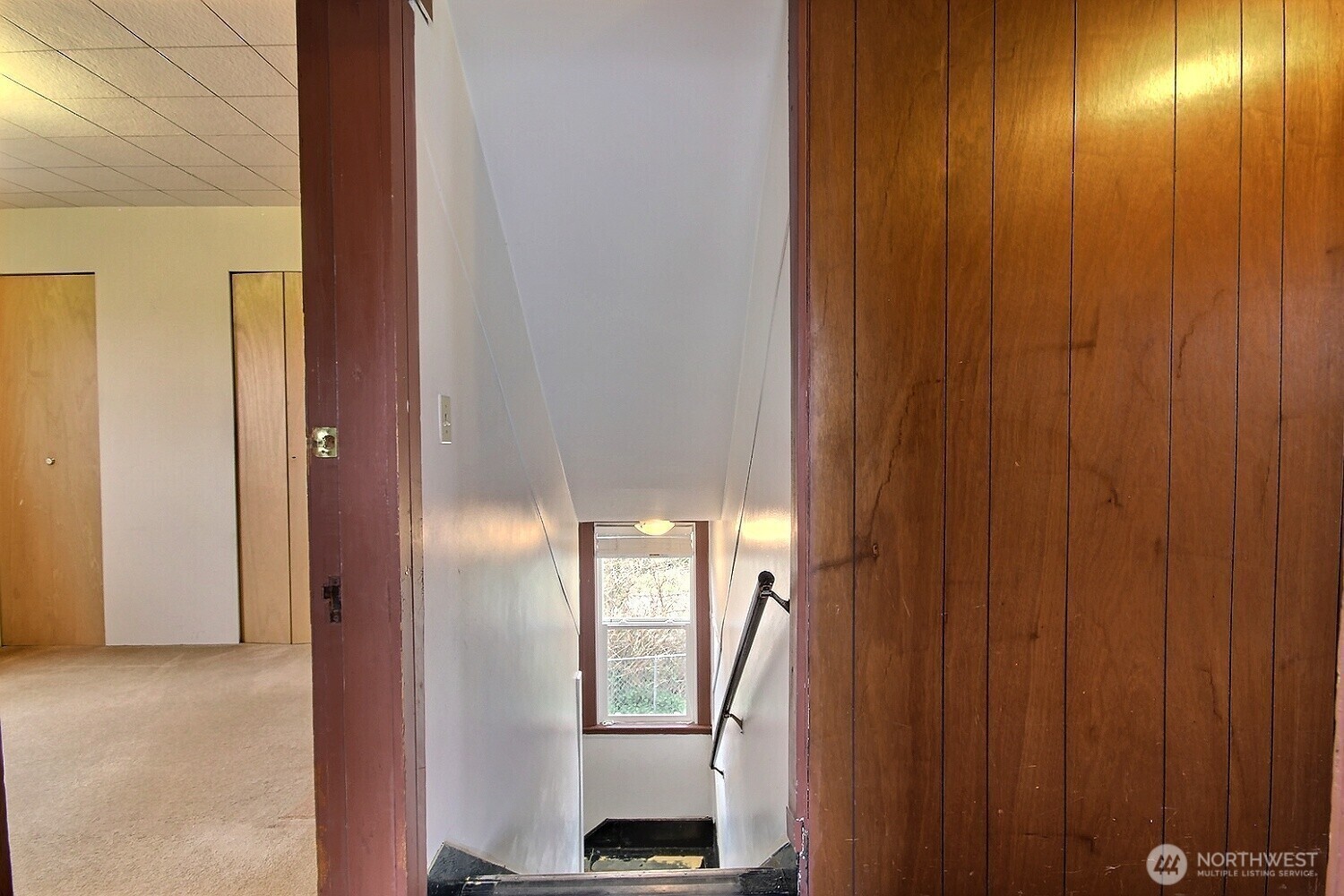 3902 South Angel Place Seattle, WA 98118 - Photo 27 of 39 a view of a hallway with wooden floor