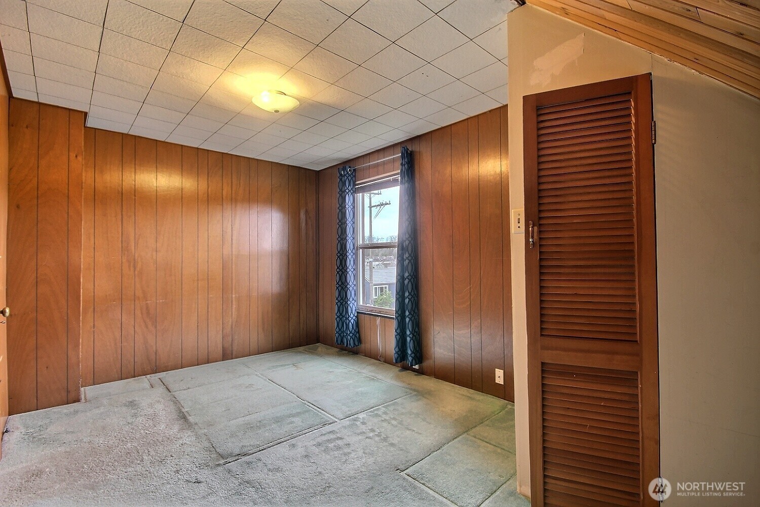 3902 South Angel Place Seattle, WA 98118 - Photo 32 of 39 a view of an empty room with wooden floor and a window