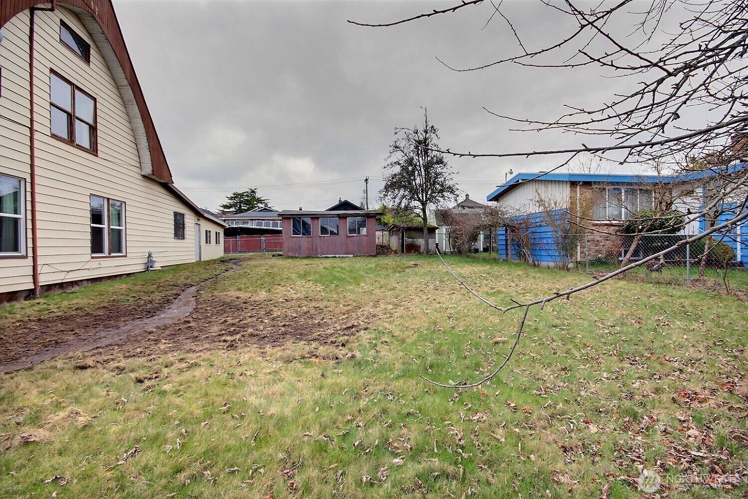 3902 South Angel Place Seattle, WA 98118 - Photo 7 of 39 a view of a house with a yard and sitting area