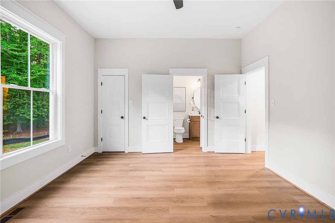 8299 Pamlico Road Ashland, VA 23005 - Photo 18 of 35 a view of an empty room with wooden floor and a window