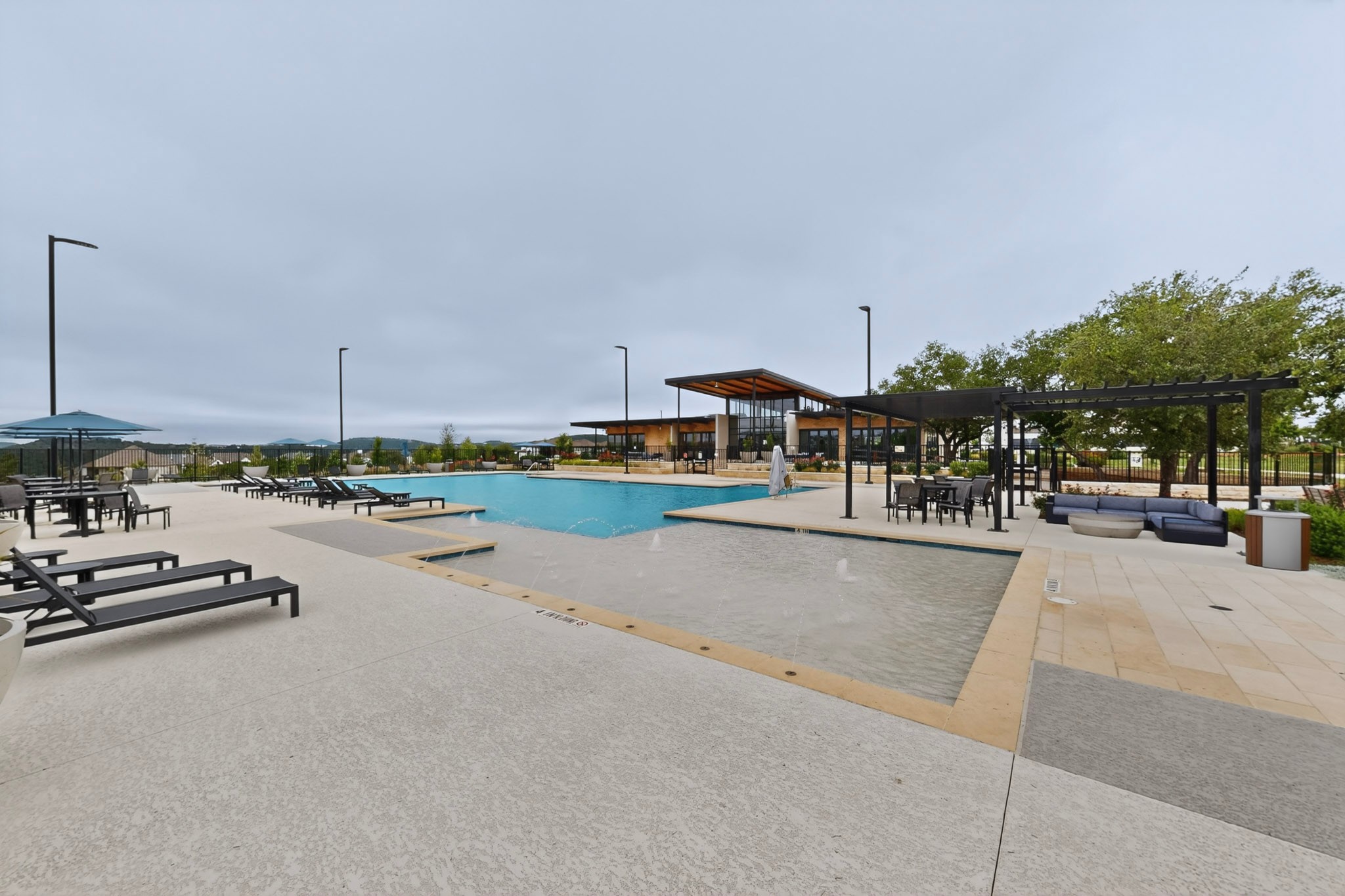 2308 Mondello Path Leander, TX 78641 - Photo 36 of 39 An inviting resort-style pool and lounging areas await at this community clubhouse.
