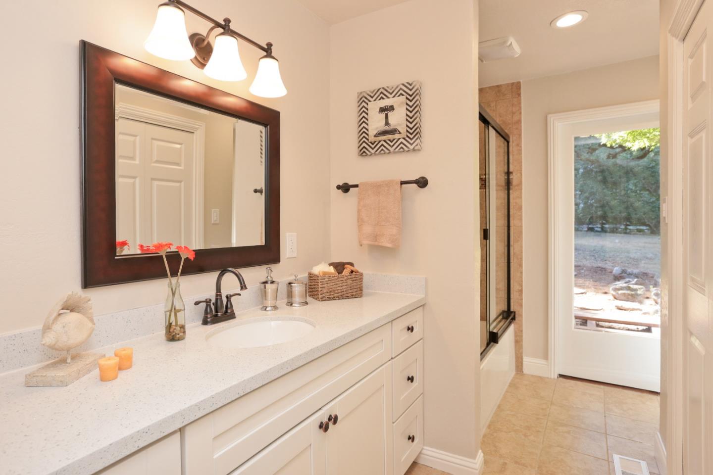 3490 Tripp Road Woodside, CA 94062 - Photo 13 of 22 a bathroom with a double vanity sink mirror and shower