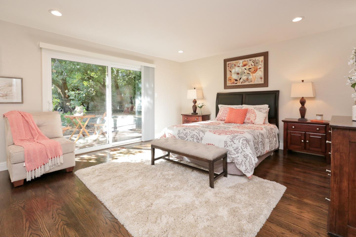 3490 Tripp Road Woodside, CA 94062 - Photo 15 of 22 a bedroom with a bed and a large window