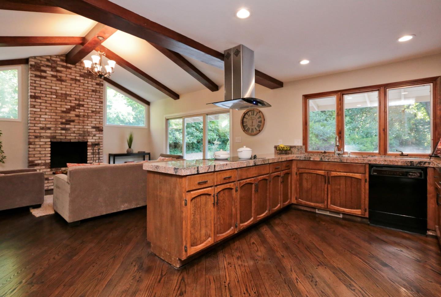 3490 Tripp Road Woodside, CA 94062 - Photo 7 of 22 a kitchen with stainless steel appliances granite countertop wooden floors and sink