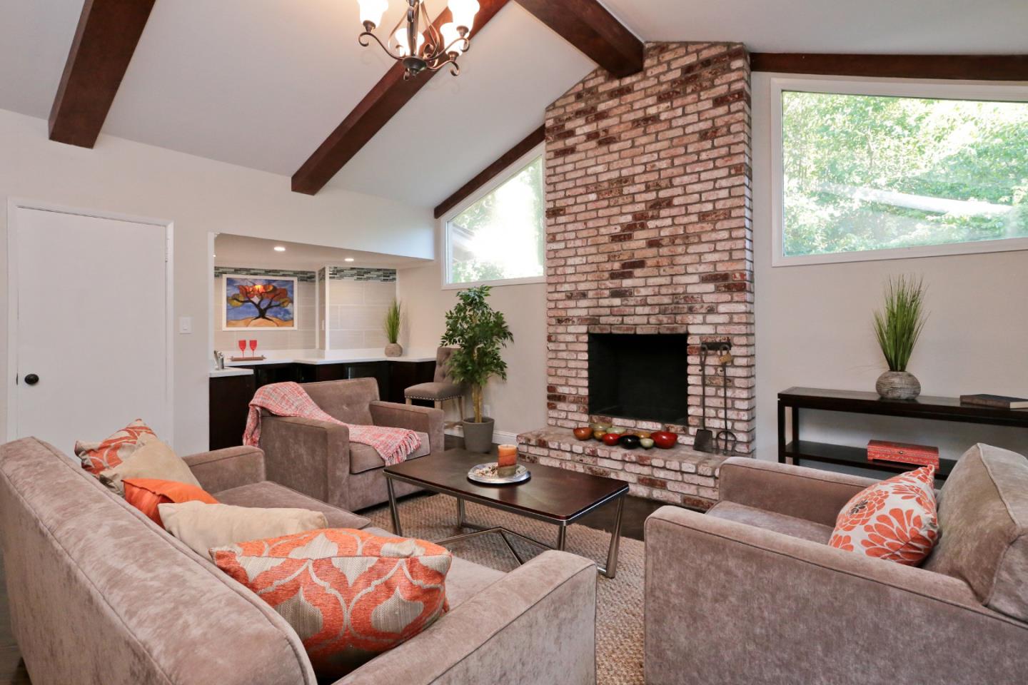 3490 Tripp Road Woodside, CA 94062 - Photo 10 of 22 a living room with furniture fireplace and a flat screen tv