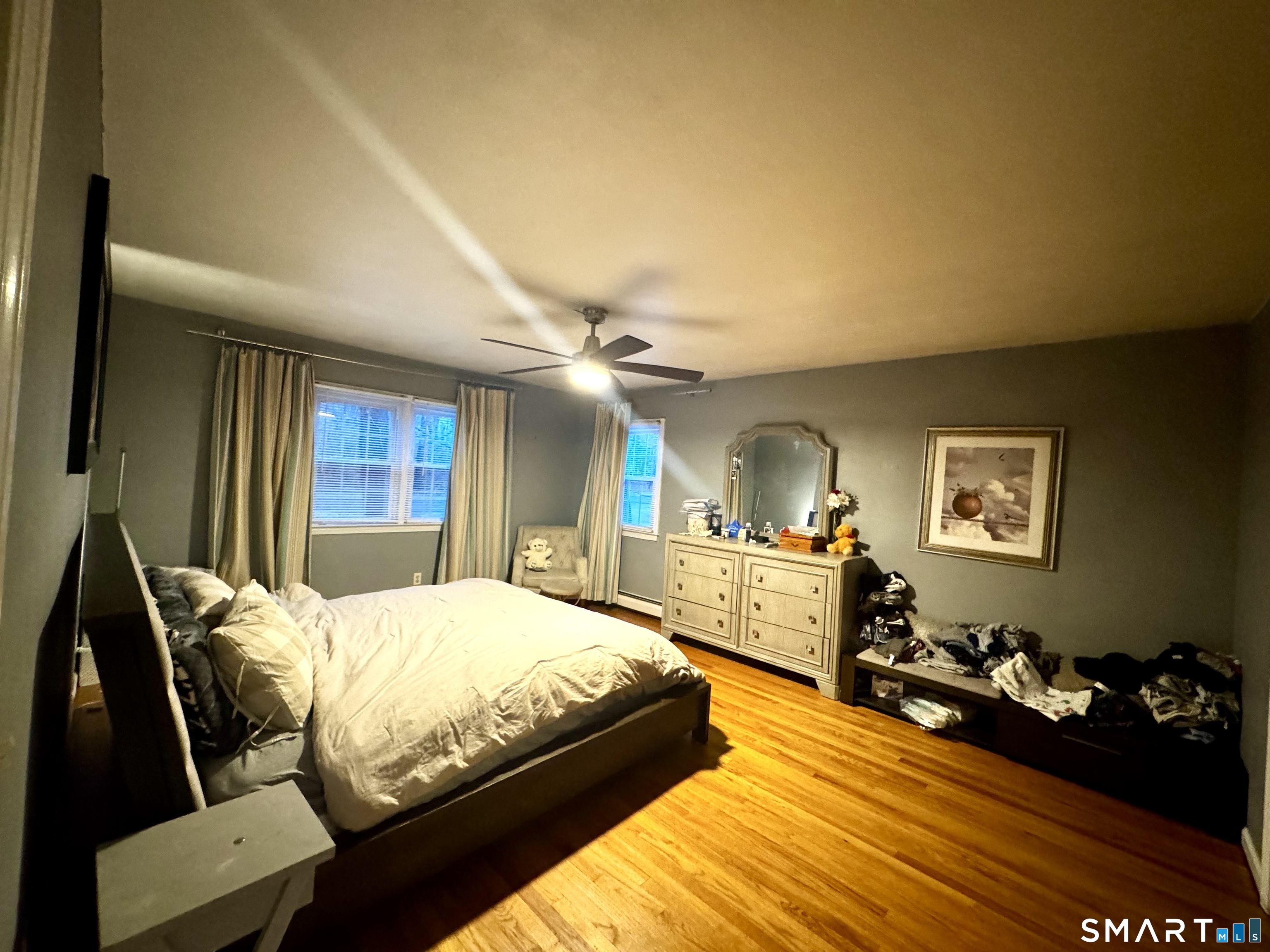 6 Redcoat Lane Trumbull, CT 06611 - Photo 14 of 30 a bedroom with furniture and a wooden floor