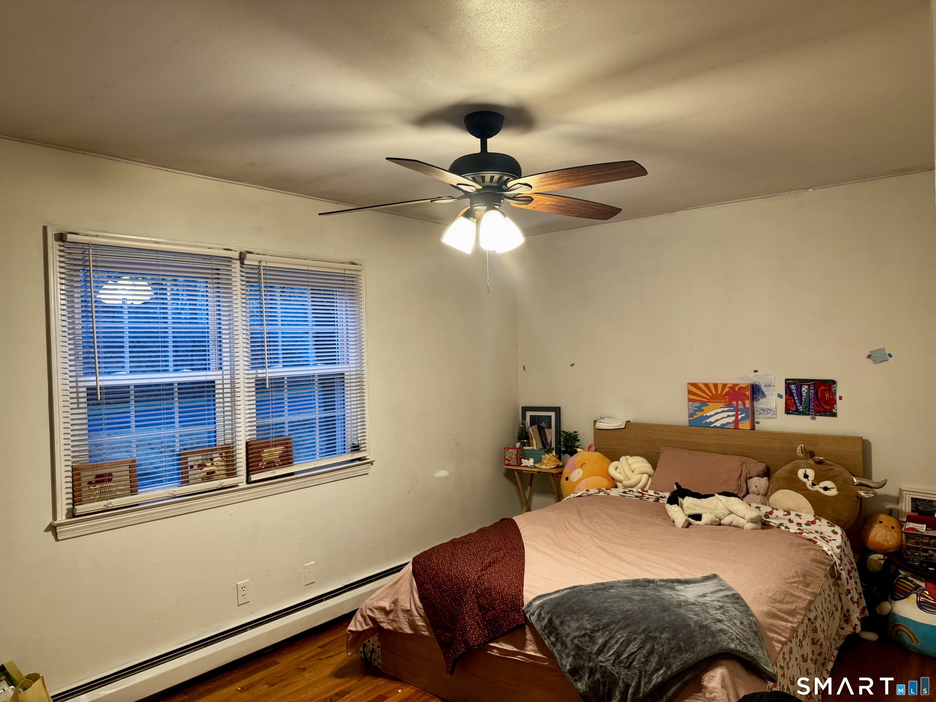 6 Redcoat Lane Trumbull, CT 06611 - Photo 15 of 30 a bedroom with a bed and a chandelier