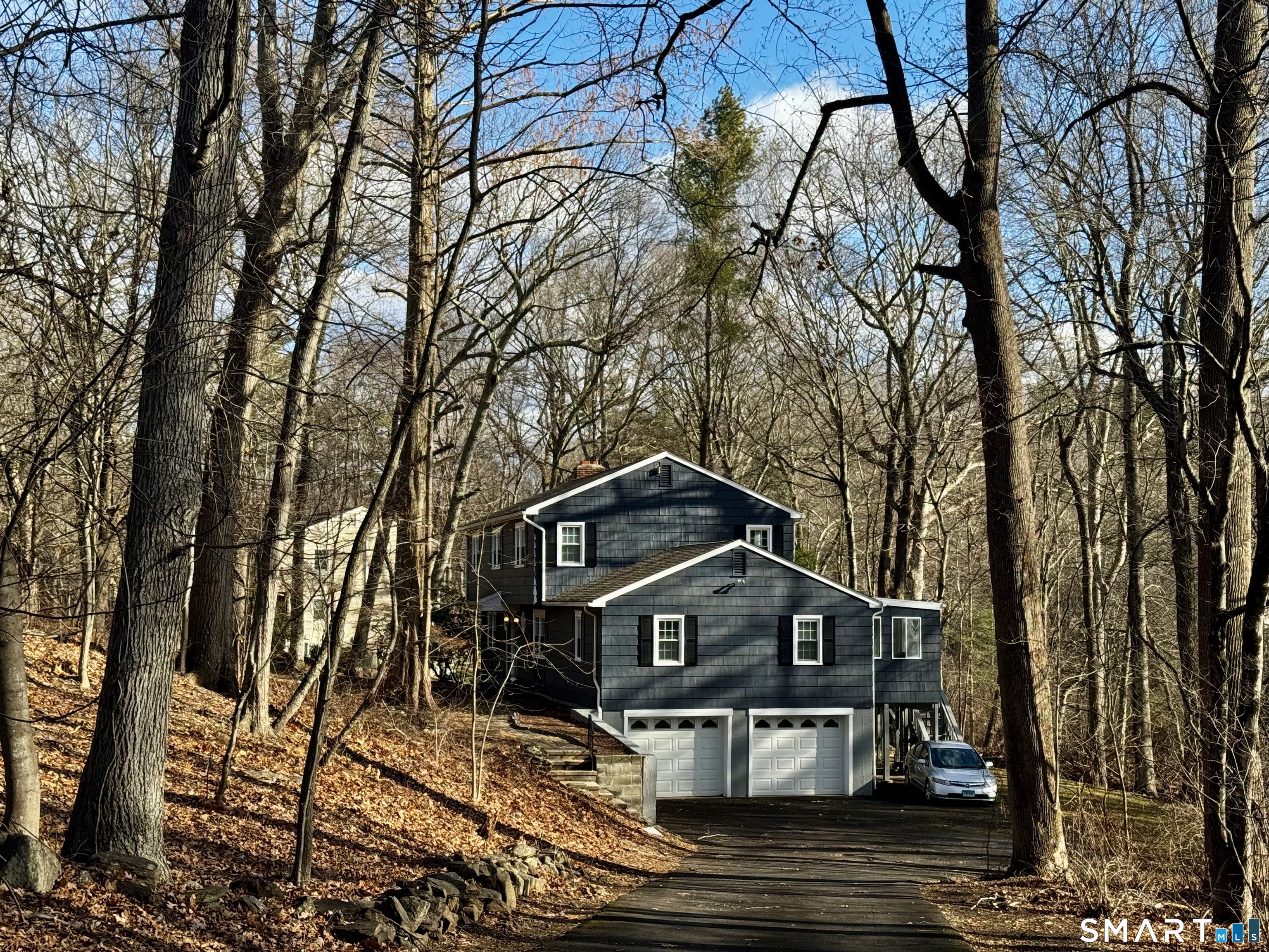 6 Redcoat Lane Trumbull, CT 06611 - Photo 2 of 30 a front view of a house with large trees