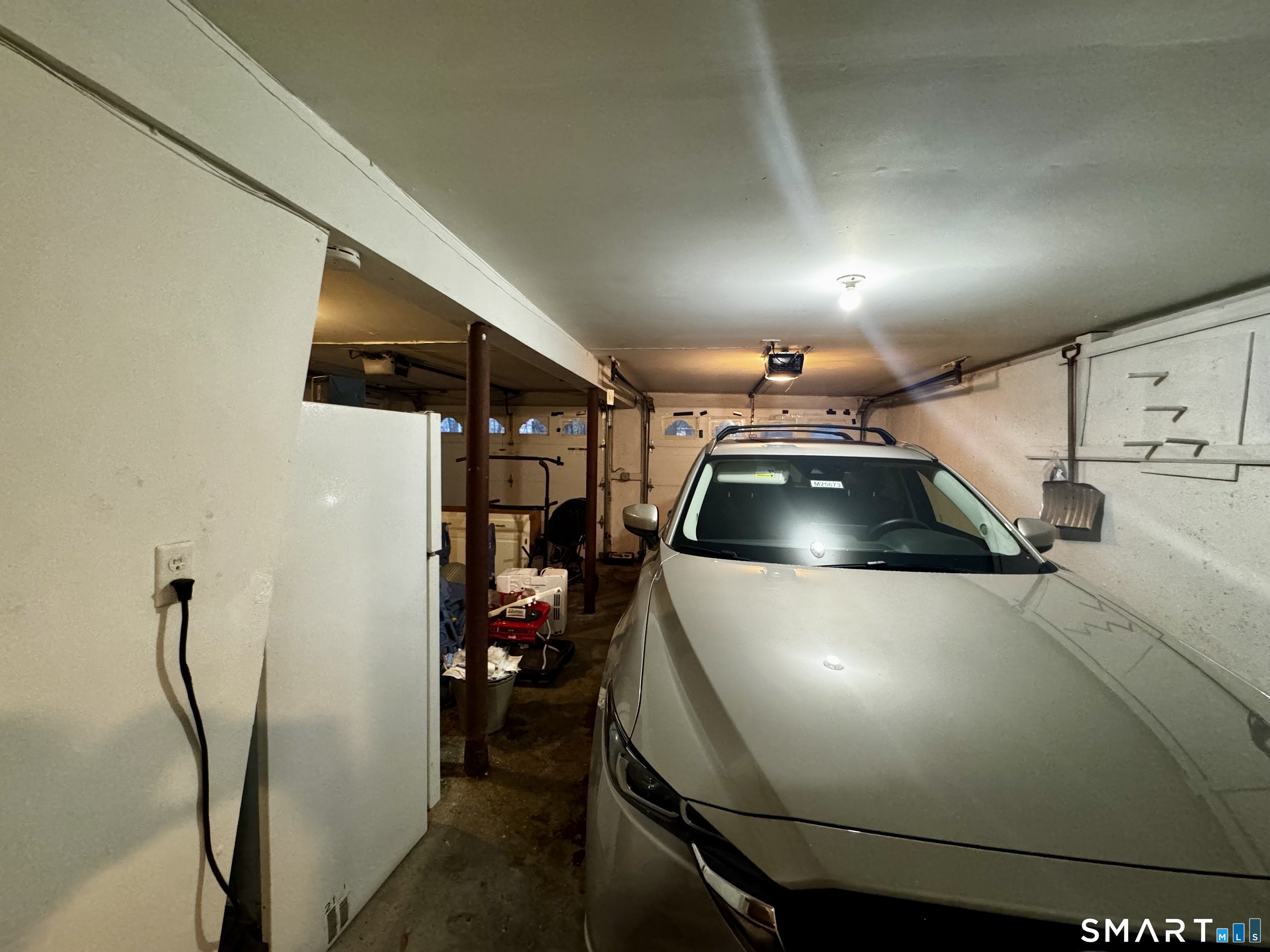 6 Redcoat Lane Trumbull, CT 06611 - Photo 27 of 30 a car parked in a parking space