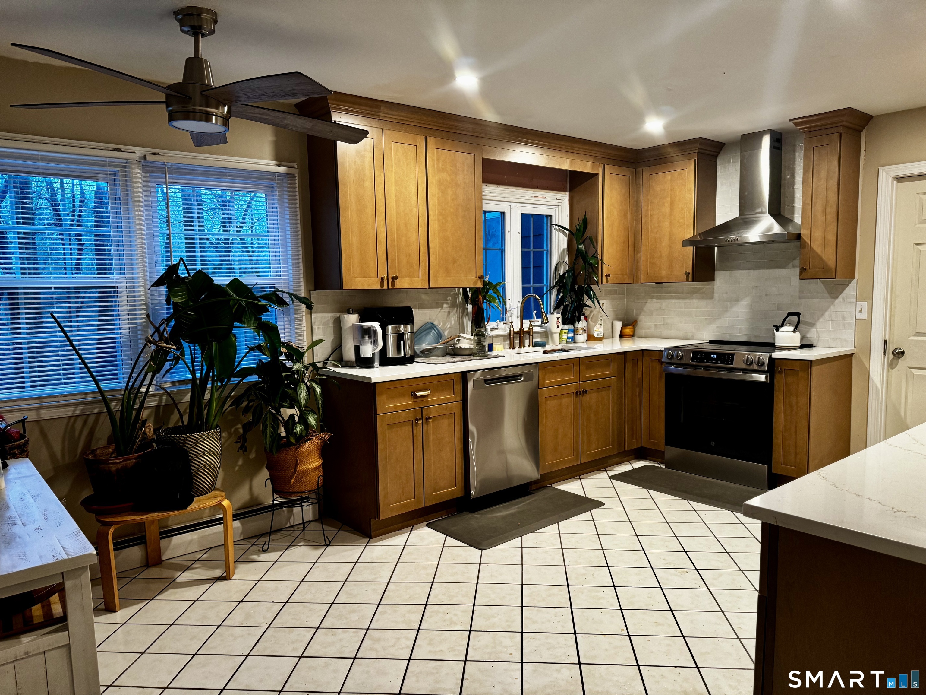6 Redcoat Lane Trumbull, CT 06611 - Photo 9 of 30 a kitchen with a sink a stove cabinets and appliances