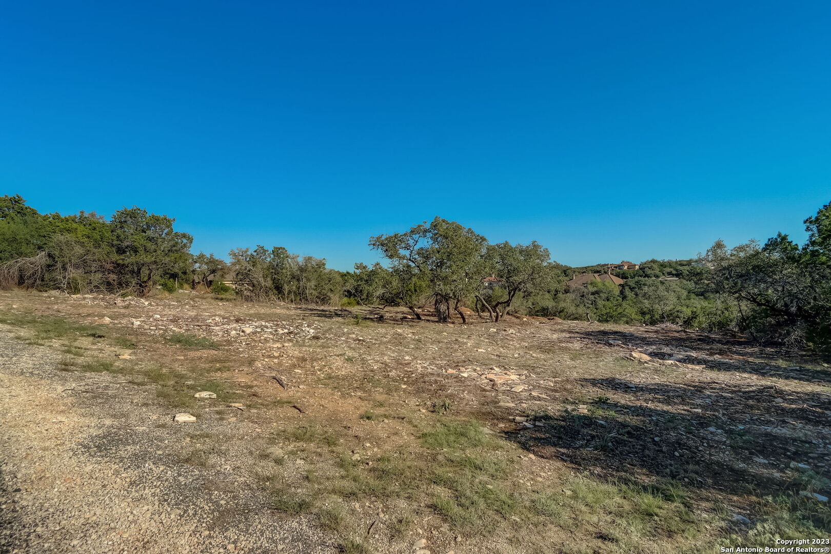 22740 Fossil Ridge San Antonio, TX 78261 - Photo 12 of 18 a view of a dirt road with trees in the background