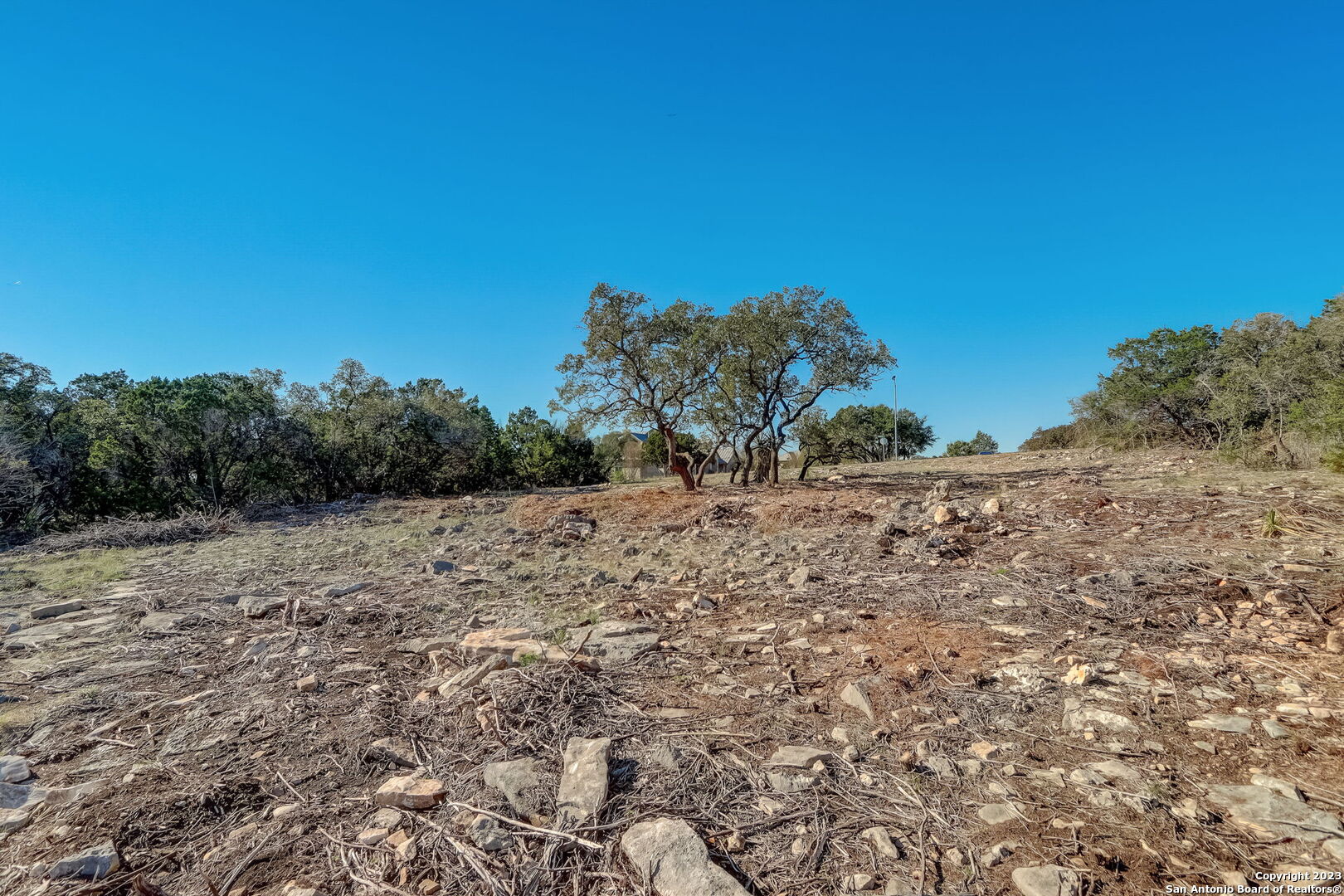 22740 Fossil Ridge San Antonio, TX 78261 - Photo 16 of 18 a view of a dry yard with wooden fence
