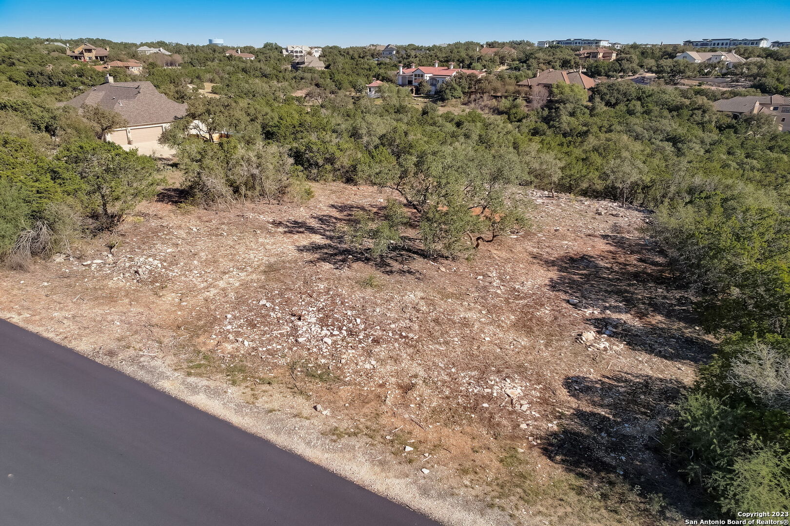 22740 Fossil Ridge San Antonio, TX 78261 - Photo 2 of 18 a view of a forest with trees in the background