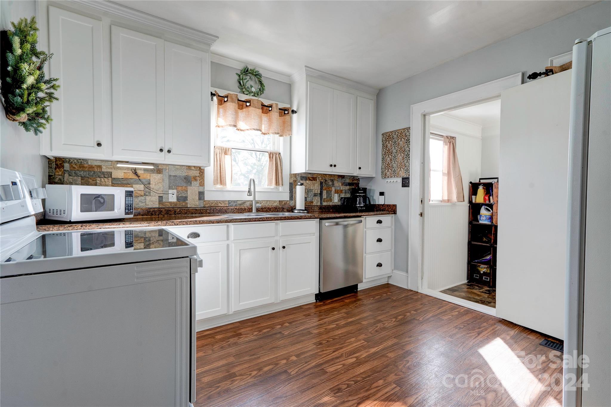 414 Poplar Springs Church Road Shelby, NC 28152 - Photo 11 of 37 a kitchen with a sink cabinets and window