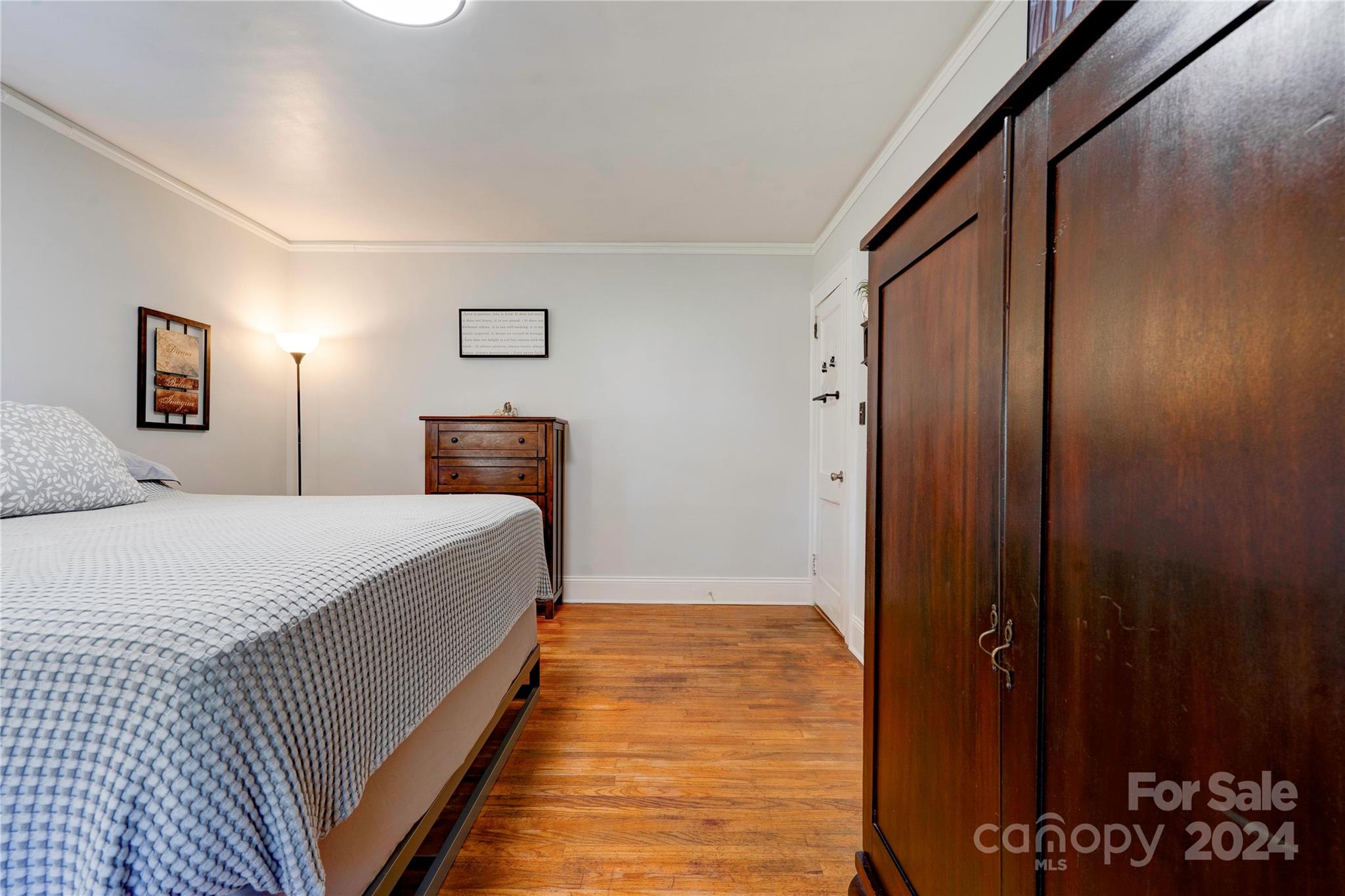 414 Poplar Springs Church Road Shelby, NC 28152 - Photo 22 of 37 a bedroom with a bed and a potted plant