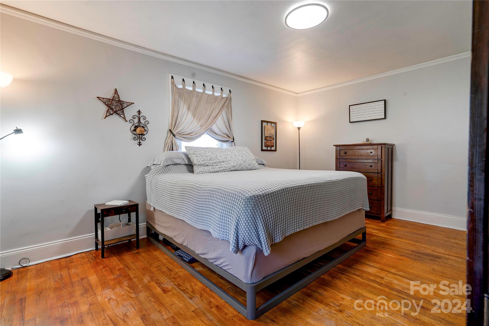414 Poplar Springs Church Road Shelby, NC 28152 - Photo 23 of 37 a bedroom with a bed and a lamp on the dresser