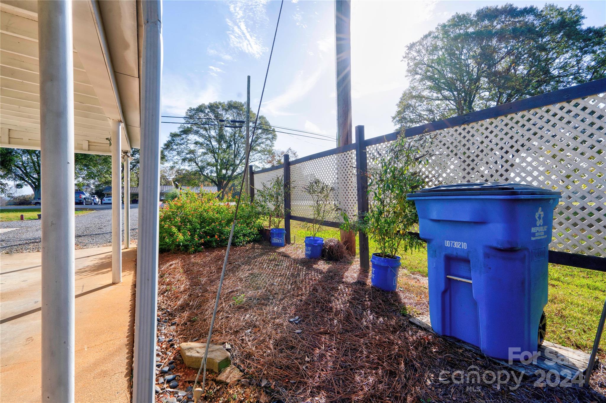 414 Poplar Springs Church Road Shelby, NC 28152 - Photo 32 of 37 a view of a pathway with a red door and a fountain