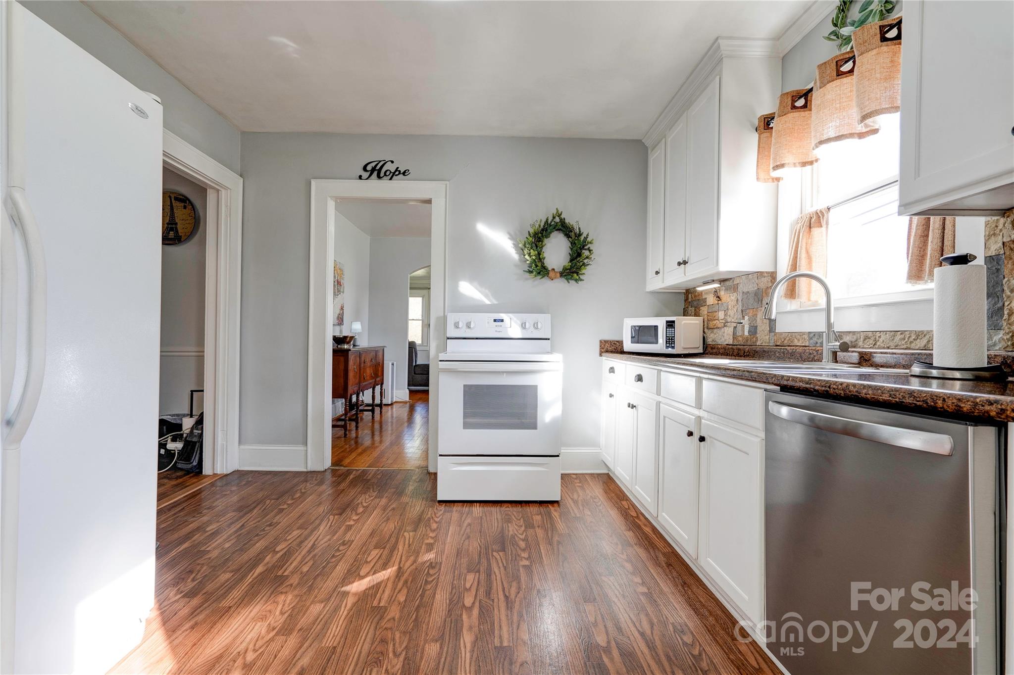 414 Poplar Springs Church Road Shelby, NC 28152 - Photo 8 of 37 a kitchen with a refrigerator and a stove top oven