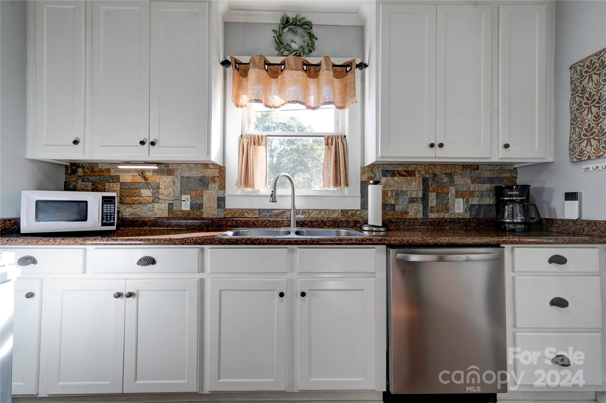 414 Poplar Springs Church Road Shelby, NC 28152 - Photo 9 of 37 a kitchen with granite countertop white cabinets white appliances and a sink