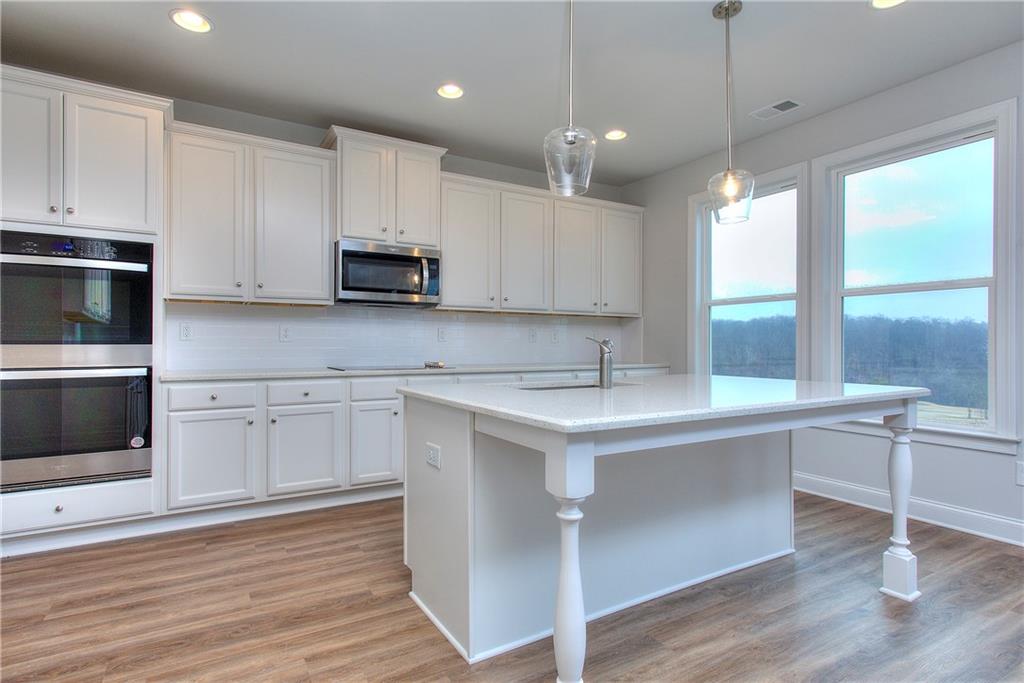113 Swallowtail Lane Homer, GA 30547 - Photo 13 of 45 a kitchen with a sink cabinets and window
