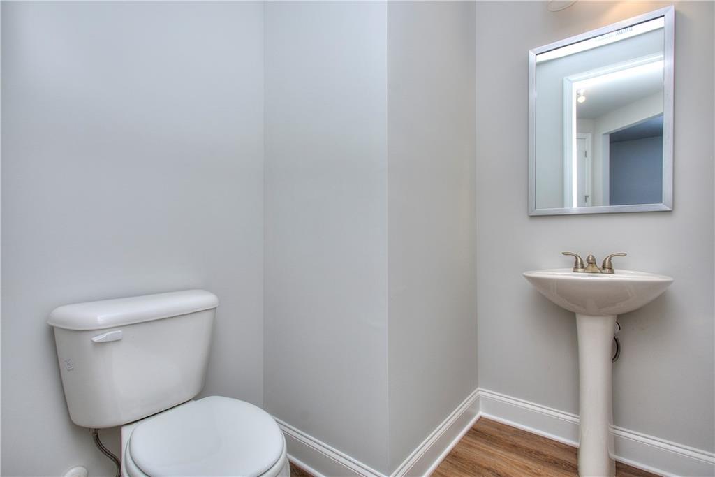 113 Swallowtail Lane Homer, GA 30547 - Photo 22 of 45 a bathroom with a sink a toilet and mirror