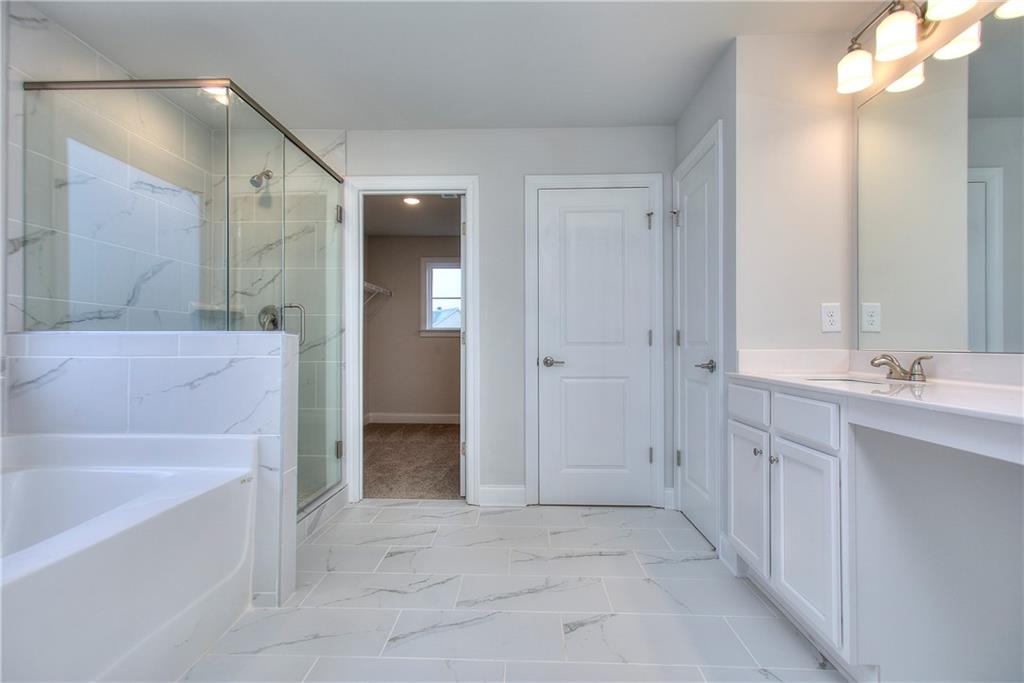 113 Swallowtail Lane Homer, GA 30547 - Photo 27 of 45 a bathroom with a sink a toilet and shower