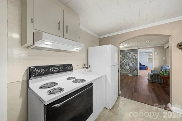 a kitchen with a stove and a refrigerator