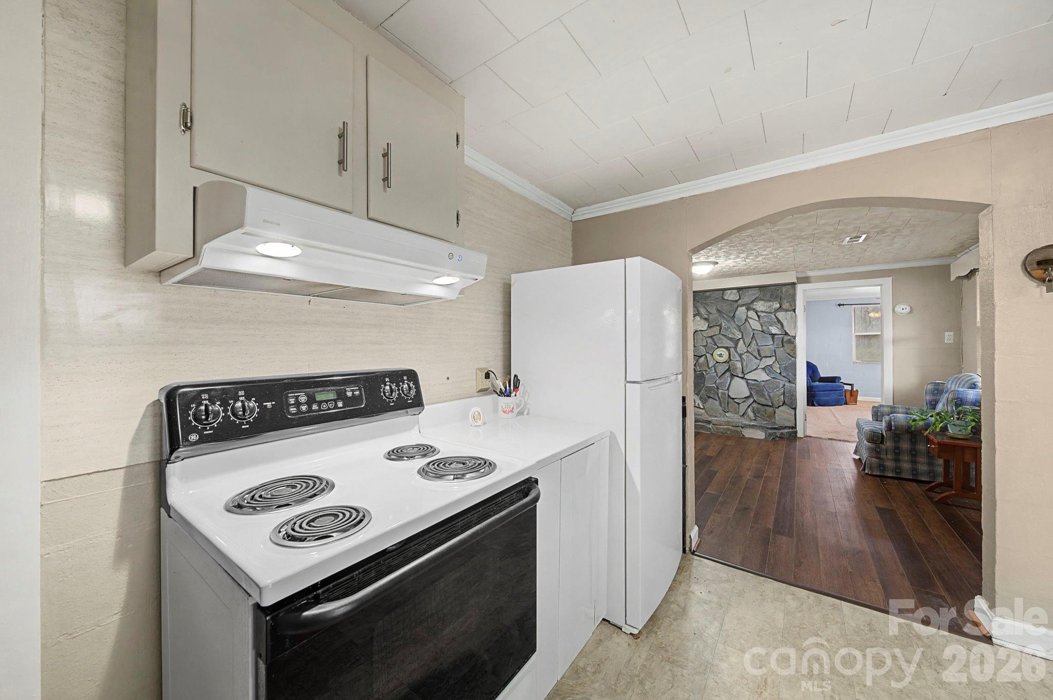 14309 Liberty Hill Church Road Oakboro, NC 28129 - Photo 13 of 37 a kitchen with a stove and a refrigerator