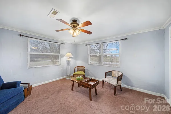 a living room with furniture and a window
