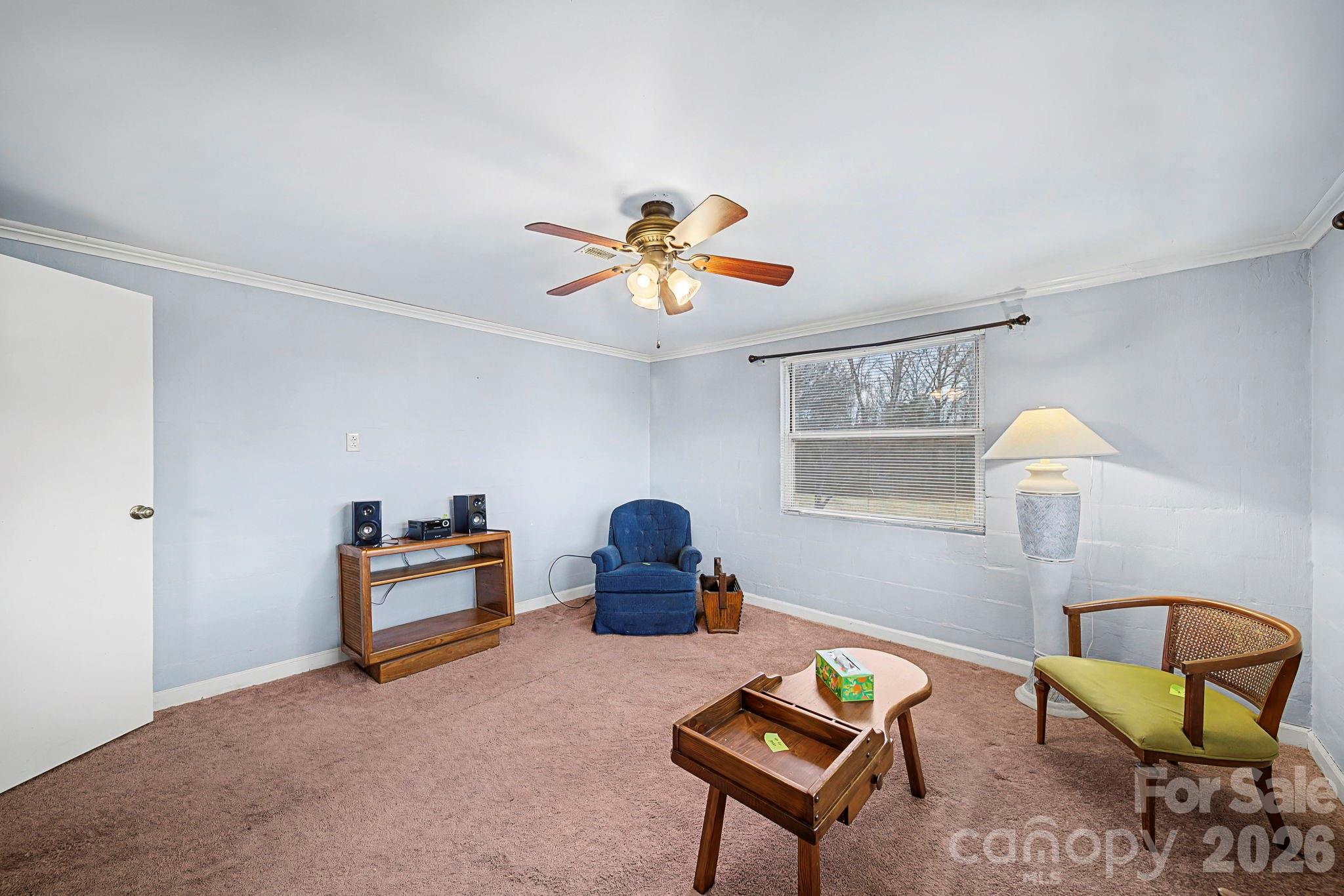 14309 Liberty Hill Church Road Oakboro, NC 28129 - Photo 16 of 37 a living room with furniture and a chandelier