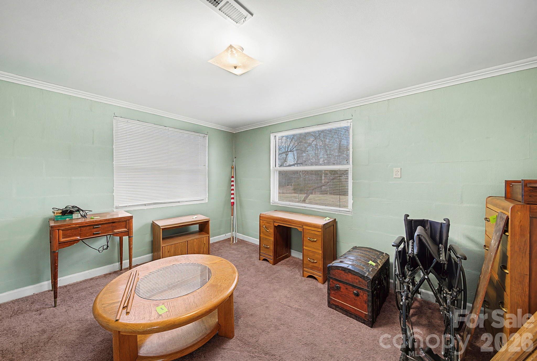 14309 Liberty Hill Church Road Oakboro, NC 28129 - Photo 19 of 37 a room with furniture a flat screen computer and a lamp
