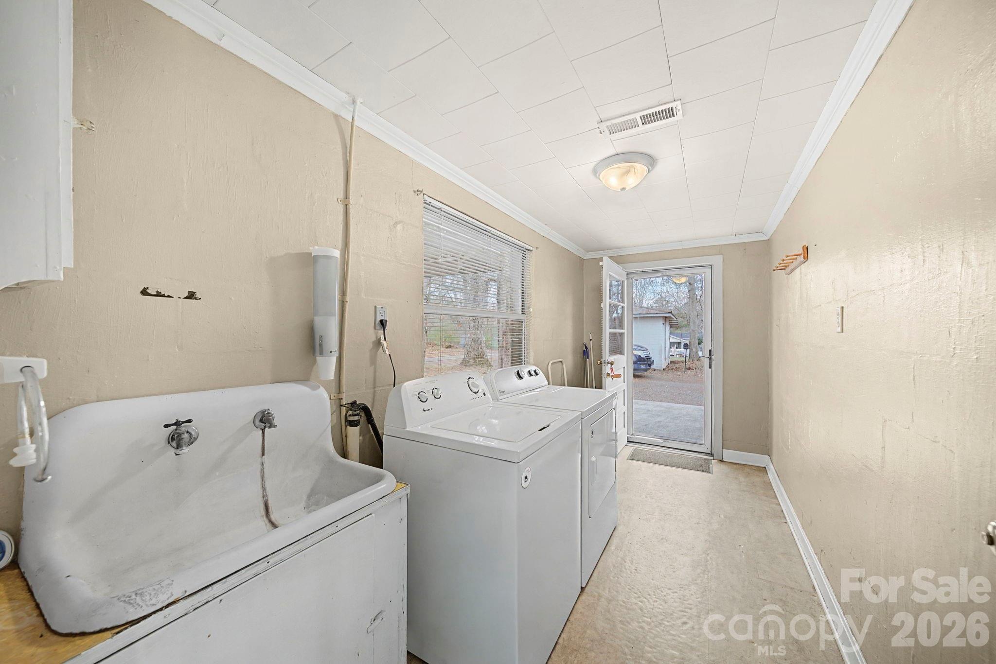 14309 Liberty Hill Church Road Oakboro, NC 28129 - Photo 24 of 37 a view of utility room with washer and dryer
