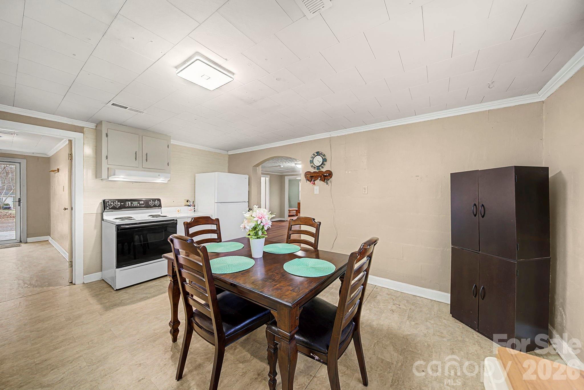 14309 Liberty Hill Church Road Oakboro, NC 28129 - Photo 10 of 37 a kitchen with a table and chairs