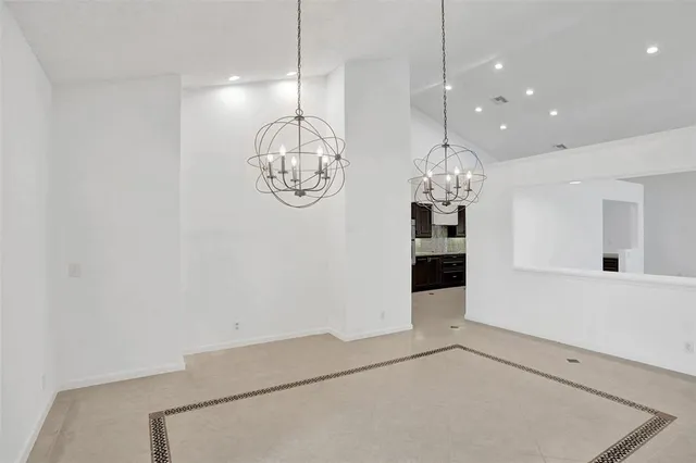a kitchen with a sink stove and microwave