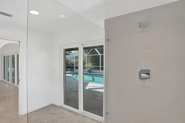 a bathroom with a sink mirror and a bathtub