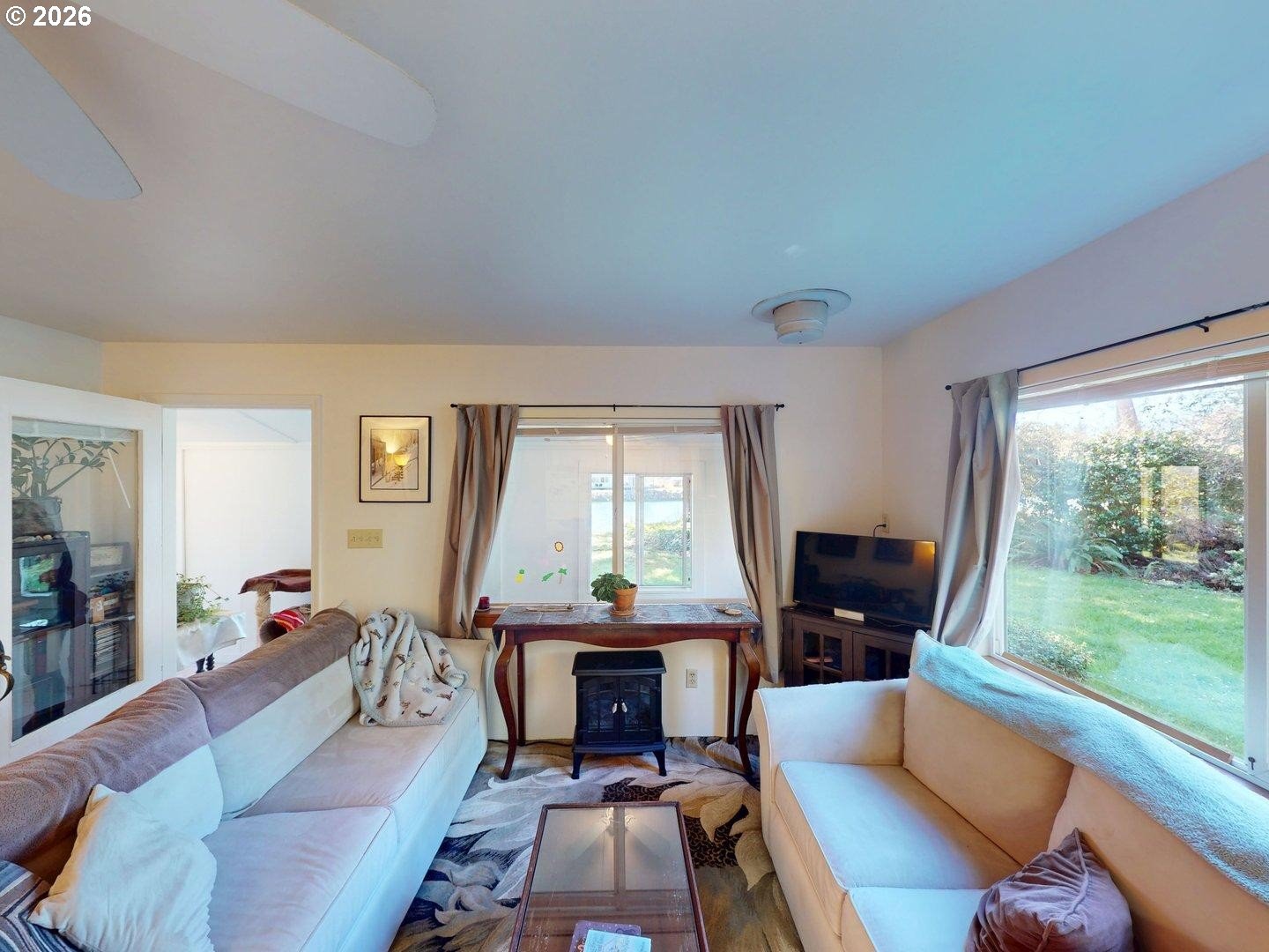 99270 Winchuck River Road Brookings, OR 97415 - Photo 14 of 40 a living room with furniture and a fireplace