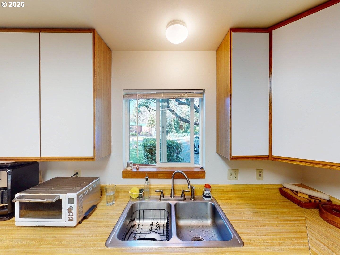 99270 Winchuck River Road Brookings, OR 97415 - Photo 22 of 40 a kitchen with a window a sink and a table in it